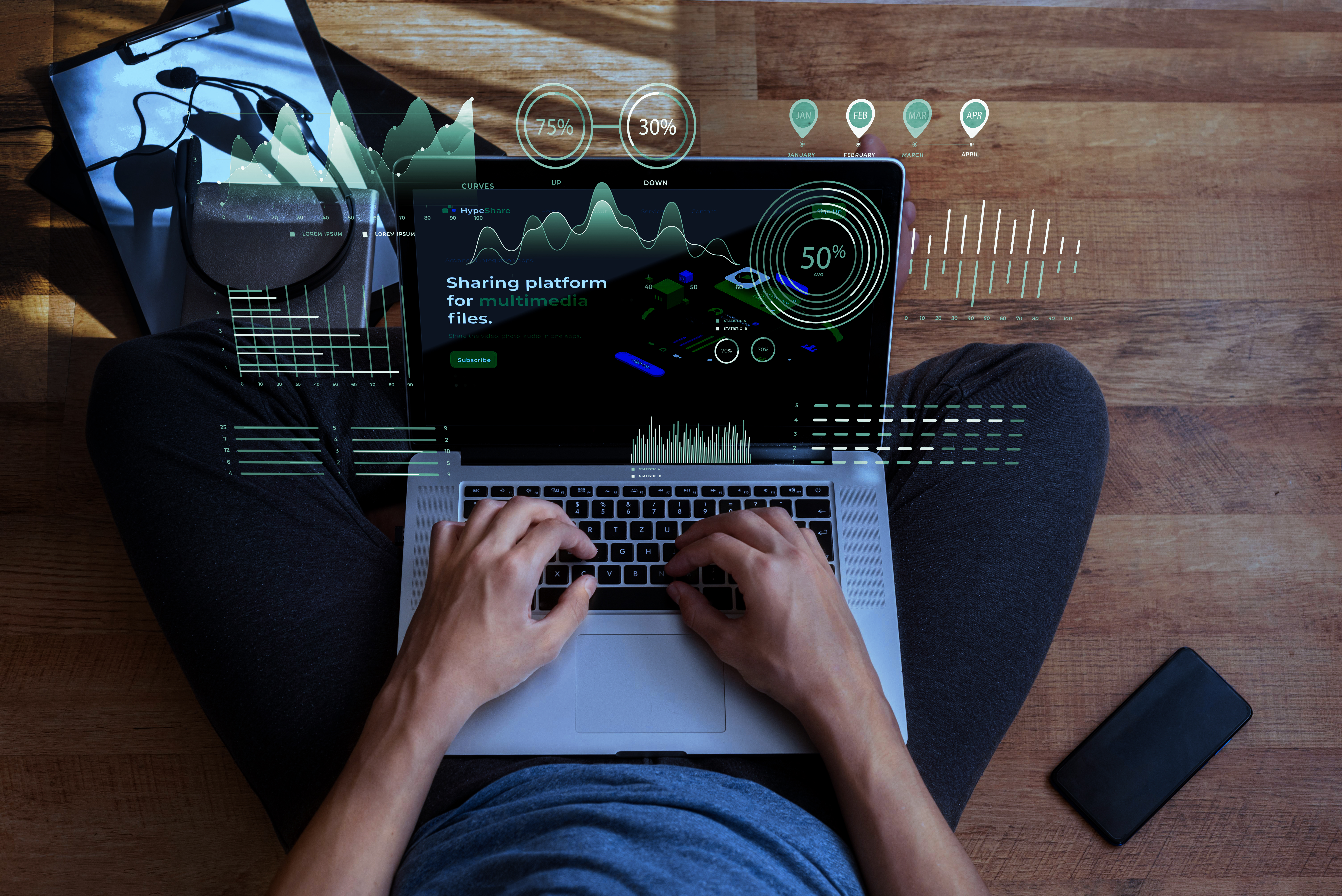 Osoba sjedi na podu i tipka na laptop, okružena digitalnim hologramima s grafikonima i postocima