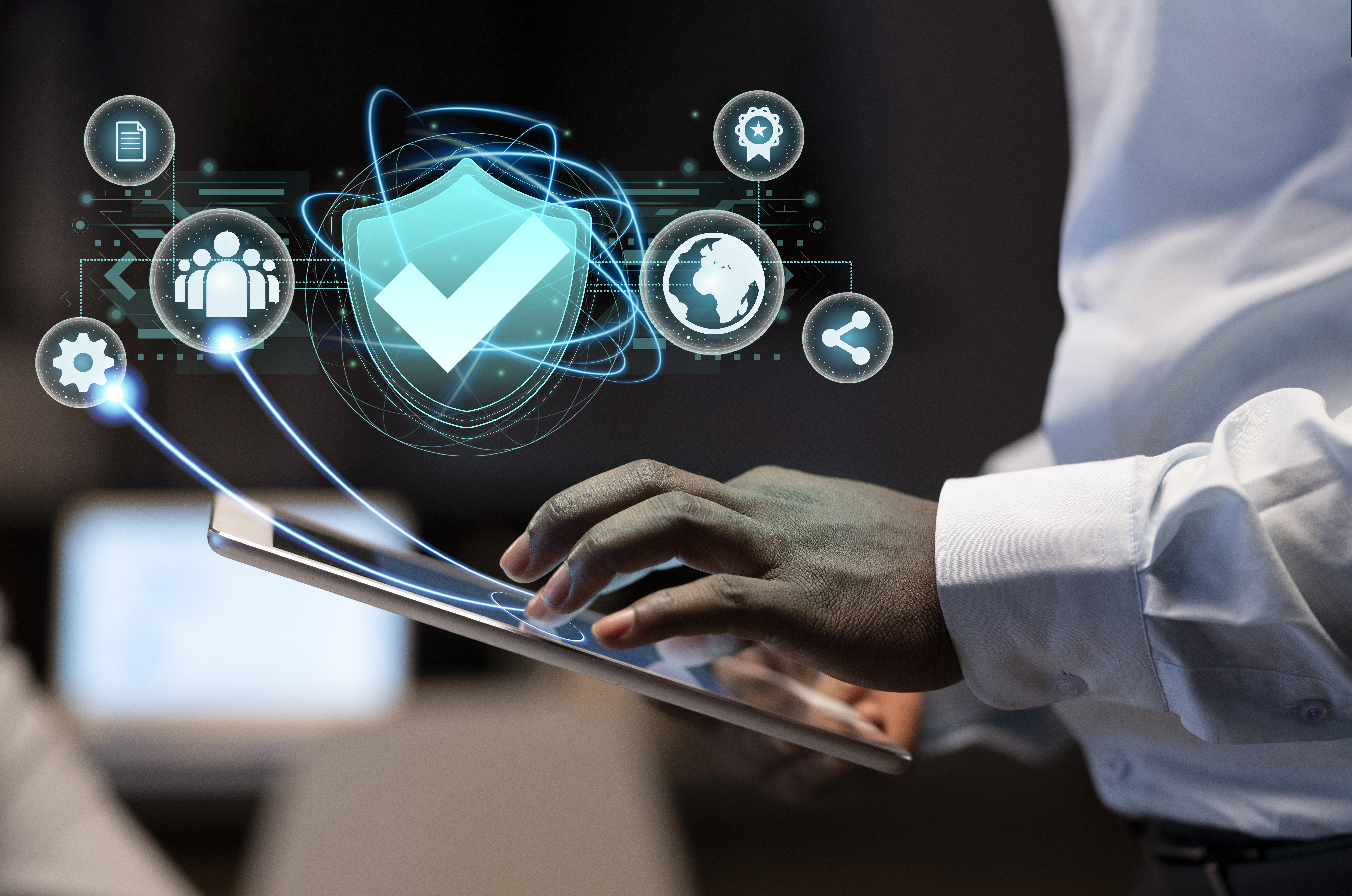 The image shows a man using a tablet, and the icons above the tablet visually indicate networking